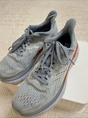 Light Gray Athletic Running Shoes with Coral Accent